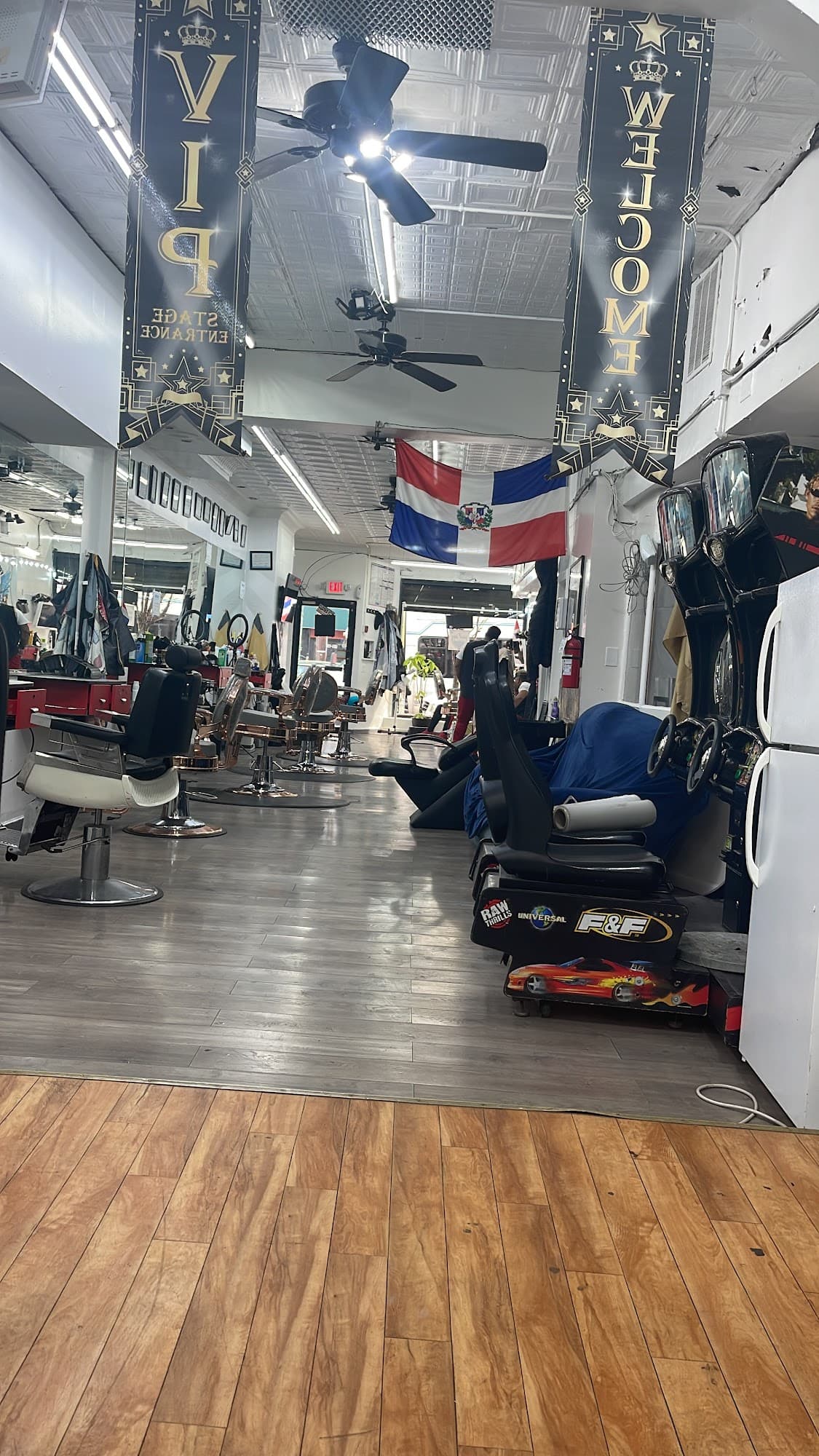 Lhouis Barber Shop interior showing chairs, decor, and shop layout