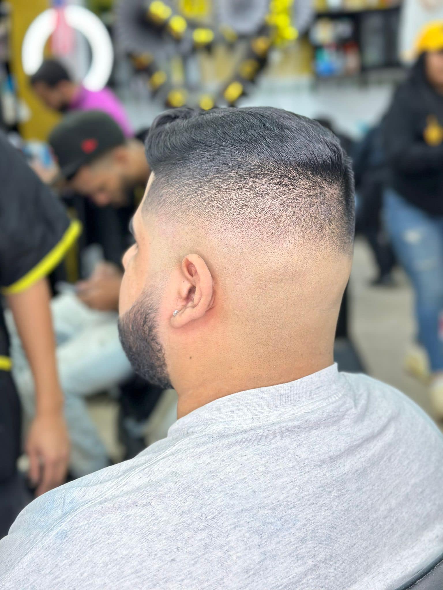 Close-up of a precision high skin fade in a barbershop